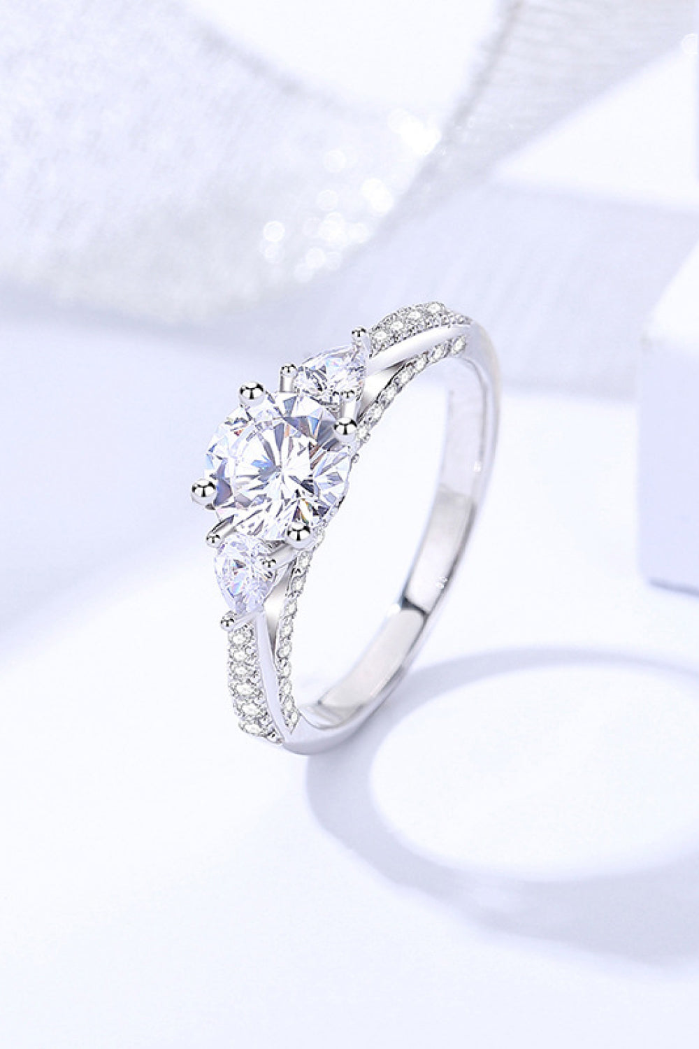 Favored 1 Carat Moissanite 4-Prong Side Stone Ring